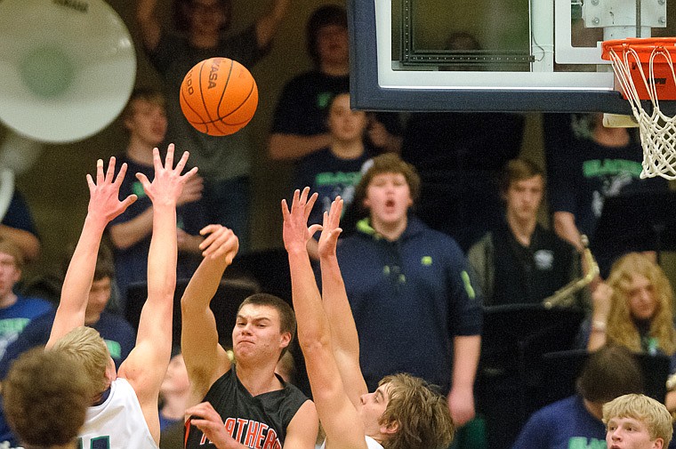 &lt;p&gt;Flathead senior Matt Quist (52) passes the ball Thursday night during the first half of the crosstown matchup between Glacier and Flathead at Glacier High School. Jan. 30, 2014 in Kalispell, Montana. (Patrick Cote/Daily Inter Lake)&lt;/p&gt;