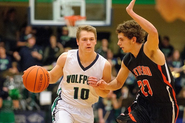 &lt;p&gt;Glacier senior guard Evan Epperly (10) drives past Flathead senior Chandler Escalante (23) Thursday night during the first half of the crosstown matchup between Glacier and Flathead at Glacier High School. Jan. 30, 2014 in Kalispell, Montana. (Patrick Cote/Daily Inter Lake)&lt;/p&gt;