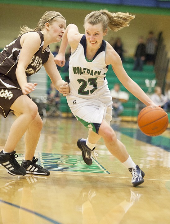 &lt;p&gt;Glacier's Amy Lybeck (23) drives past a Helena Capital defender
during Friday night's Western AA game at Glacier High School.&lt;/p&gt;