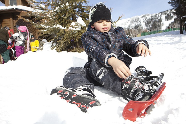 &lt;p&gt;Kolton Nevins, 8, works to take of his snowshoes at Big Mountain
Friday morning. Elrod students snowshoe Friday morning at Big
Mountain as part of the Junior Snow Ranger Forest Service
program.&lt;/p&gt;