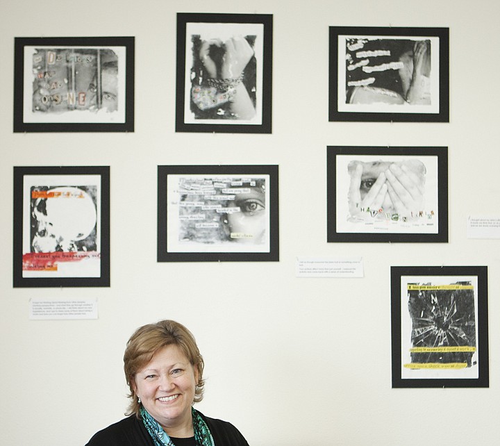 &lt;p&gt;Diane Dwyer, victim impact program coordinator for the Center
for Restorative Youth Justice, stands by a wall covered in art work
from children she has worked with. The art was created as a
reflection exercise where the child was given a &quot;Victim Impact
Statement&quot; and told to create a collage based on the statement.&lt;/p&gt;