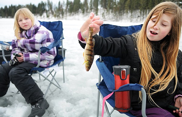 &lt;p&gt;Smith Valley fifth-grader Camicia Douglas, right, shows off a
fish she caught at Peterson Lake near Bigfork Thursday morning. In
the background is fellow fifth-grader Kalea Quinby. The students
were part of a group of about 55 fourth- and fifth-graders from
Smith Valley participating in the Hooked on Fishing program put on
by Montana Fish, Wildlife and Parks.&lt;/p&gt;