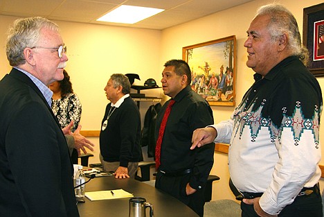 &lt;p&gt;North Idaho College Board member Ken Howard, left, talks with Coeur d&#146;Alene Tribal Council member John Abraham about topics of mutual interest between the college and tribe in Plummer on Wednesday. Behind them are Ernie Stensgar and Chief Allan, both tribal council members.&lt;/p&gt;