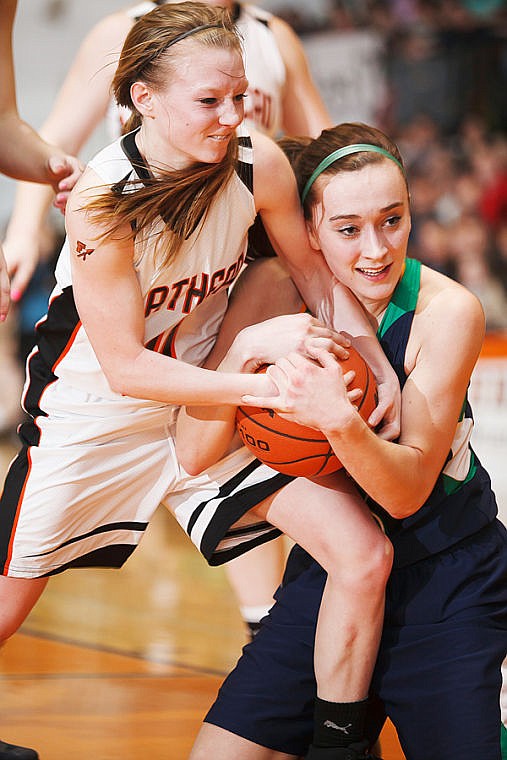 &lt;p&gt;Flathead senior Sani Davis (left) and Glacier senior Rachel Chery (right) battle for possession of the ball Tuesday night during the crosstown matchup at Flathead High School.&#160;&lt;/p&gt;