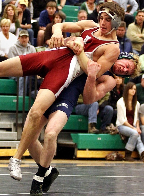 Glacier's Luke Cummings lifts up Helena High's Nate Caldwell before taking him down to the mat in a 152-pound division Saturday evening at Glacier. Cummings won by decision, 2-0.