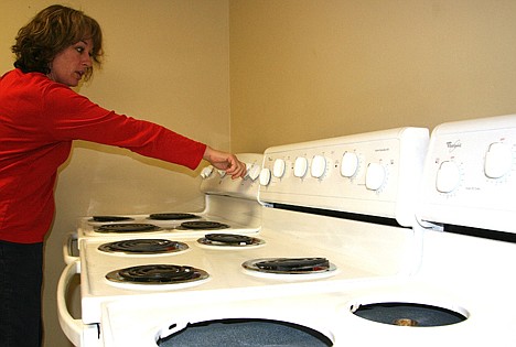 &lt;p&gt;Toni DIedrich, a volunteer at the Kootenai Humane Society's thrift store in Post Falls, checks out stoves on Tuesday after they arrived for the fundraiser set for Friday and Saturday.&lt;/p&gt;