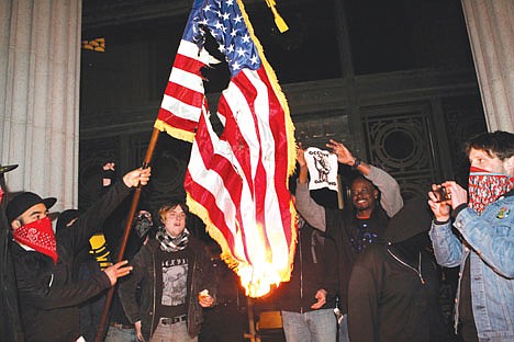 &lt;p&gt;Occupy Oakland protestors burn an American flag found inside Oakland City Hall during an Occupy Oakland protest on the steps of City Hall, Saturday, January 28, 2012, in Oakland, Calif. (AP Photo/Beck Diefenbach)&lt;/p&gt;