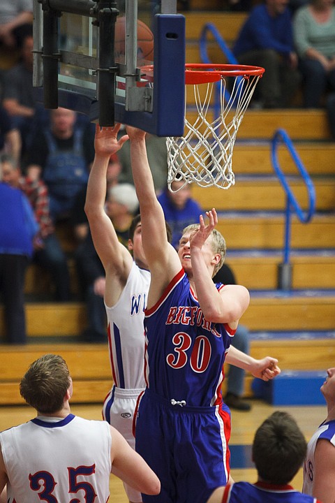 <p>Bigfork's Tyler Kirby (30) lays the ball in Thursday night during Bigfork's non conference victory over Columbia Falls.. Thursday, Jan. 31, 2013 in Columbia Falls, Montana. (Patrick Cote/Daily Inter Lake)</p>
