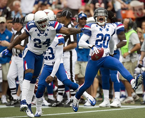 &lt;p&gt;Atlanta's Brent Grimes (20), right, celebrates with Arizona's Adrian Wilson (24) after Grimes made an interception during the second quarter of the Pro Bowl on Sunday in Honolulu.&lt;/p&gt;