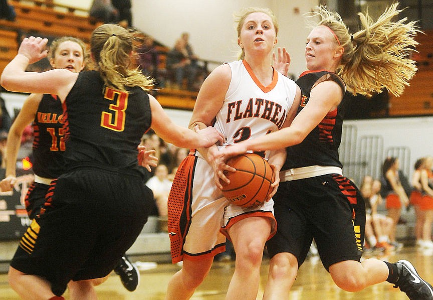 &lt;p&gt;Flathead&#146;s Jessica Simmons (center) is fouled by Missoula Hellgate defenders Darby Henthorn (3) and Sydney Riddle (right) as Simmons drives to the basket during the second quarter at Flathead on Saturday. (Aaric Bryan/Daily Inter Lake)&lt;/p&gt;