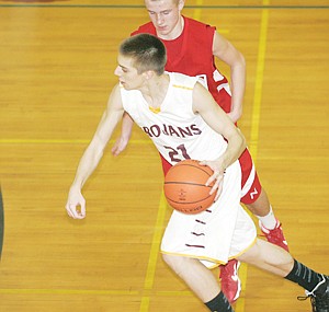 &lt;p&gt;Senior guard Nathan Olds drives on Noxon's Corey Tessier in third quarter Saturday during Throwback Night.&lt;/p&gt;