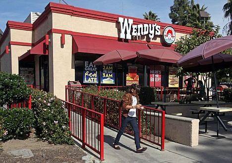 &lt;p&gt;In this Jan. 29, 2012 photo, a customer leaves a Wendy's restaurant in Los Angeles. Wendy?s Co.?s adjusted net income fell to $4.3 million in the fourth quarter, a 29 percent drop from $6.1 million a year ago. (AP Photo/Reed Saxon)&lt;/p&gt;