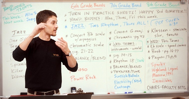 Mark McCrady directs the Whitefish Middle School band on Wednesday afternoon. McCrady spends his mornings at the high school and afternoons at the middle school.