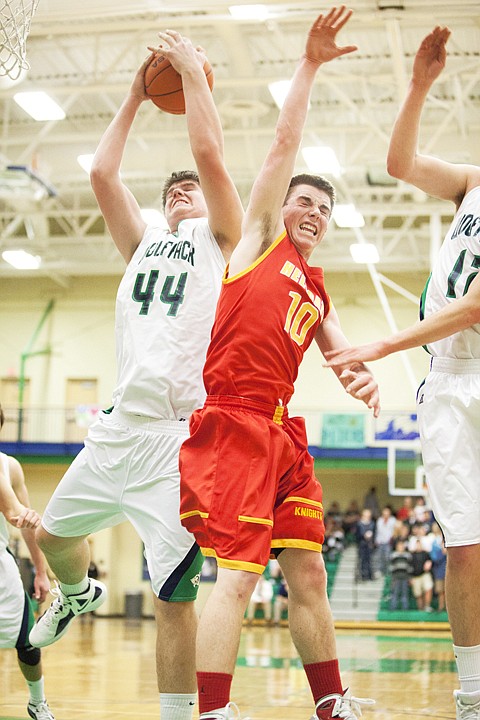 <p>Glacier junior Ryan Edwards (44) battles for a rebound over
Hellgate's Brady Henthorn (10) during the Wolfpack's home matchup
against the Knights Tuesday evening.</p>