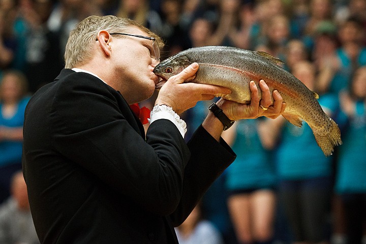 &lt;p&gt;SHAWN GUST/Press Derek Kohles, International Baccalaureate History of the Americas instructor for Lake City High School, kisses a dead rainbow trout Friday during the school's pep rally in preparation for the annual Fight for the Fish basketball rivalry game.&lt;/p&gt;