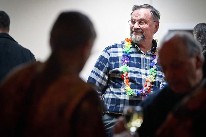 &lt;p&gt;JEROME A. POLLOS/Press Sporting a retirement lei adorned with coins and silk flowers, John Stamsos scans the dining hall Thursday at the Lake City Senior Center during his retirement party. The senior planner retired after 26 years working for the City of Coeur d'Alene. &quot;One of your greatest assets is your reliability. We can count on you John, and you could be counted on to be here every day and for every public hearing that was scheduled,&quot; said Mayor Sandi Bloem. &quot;You earned the praise of citizens, commissioners, and council members, and you never wavered in providing consistent, professional service.&quot;&lt;/p&gt;