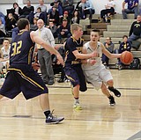 Royal boys trample Naches, fall to Connell in hoops