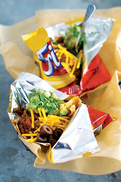 &lt;p&gt;This Jan. 4, 2012 photo shows Elizabeth Karmel's recipe for a walking taco in Concord, N.H. A walking taco is a variety of toppings dumped into a snack-size bag of Fritos and eaten right from the bag. (AP Photo/Matthew Mead)&lt;/p&gt;