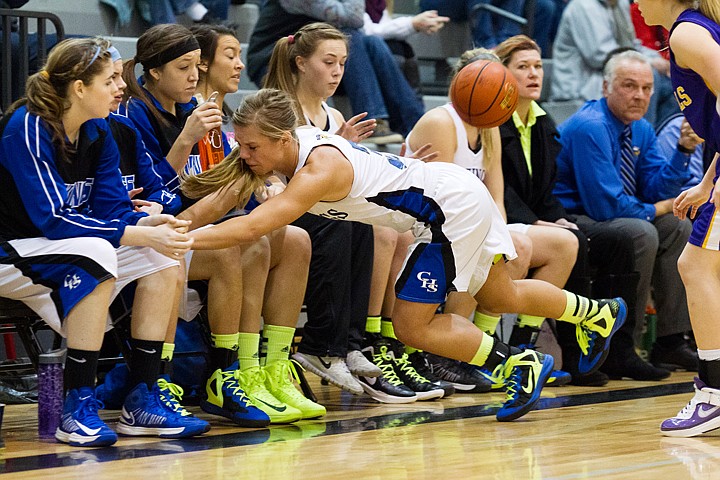 &lt;p&gt;SHAWN GUST/Press&lt;/p&gt;&lt;p&gt;Madison Sumner, of Coeur d'Alene, falls onto her own team bench after being pushed by Lewiston defender Caitlin Teichmer in the fourth quarter.&lt;/p&gt;