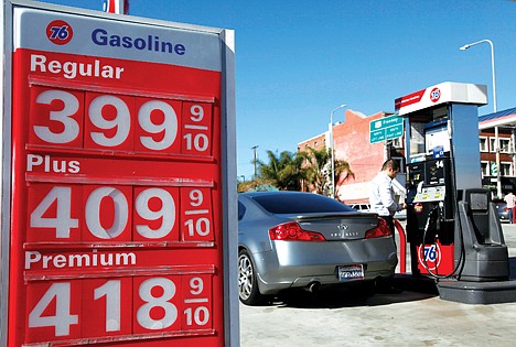 &lt;p&gt;A man buys gas at a station Thursday in Los Angeles. Gasoline prices are climbing as rising economic growth boosts oil prices and temporary refinery outages crimp gasoline supplies on the East and West Coasts.&lt;/p&gt;