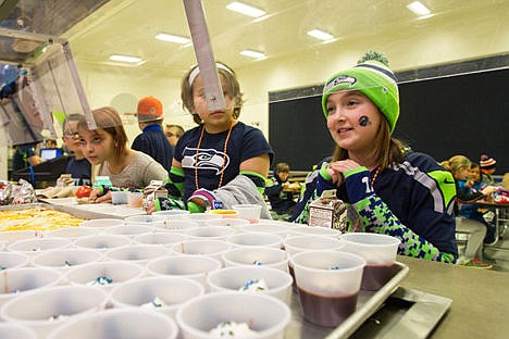 &lt;p&gt;Kate White, 5th grader at Bryan Elementary School asks for some Seahawks pudding on Friday during the schools sports themed lunch. Students were encouraged to wear their favorite sports team's jersey and hat to school today.&lt;/p&gt;