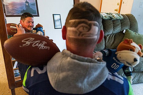 &lt;p&gt;Jimm Ferriby, of Coeur d&#146;Alene, recently had the Seattle Seahawks&#146; logo shaved into the back of his head as a show of support for his favorite professional football team. Among his Seahawks memorabilia collection are a football signed by former running back Shaun Alexander and a dancing dog that he turns on after his team scores.&lt;/p&gt;