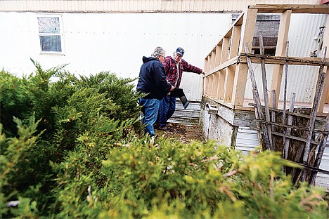 &lt;p&gt;Greg Kunkel, construction supervisor for Habitat for Humanity, left, and volunteer Bob Granger discuss their plan to make repairs on a client&Otilde;s home Monday in Coeur d'Alene. The work is being done as part of the organization&Otilde;s A Brush with Kindness program.&lt;/p&gt;