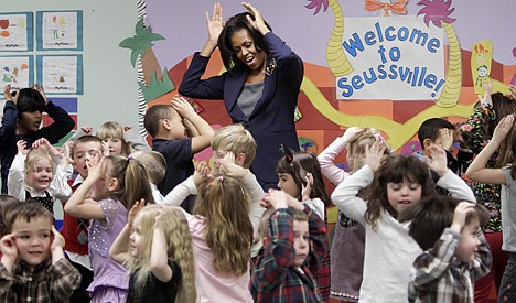 &lt;p&gt;First lady Michelle Obama does a bunny hop dance with pre-schoolers at the Penacook Community Center in Concord, N.H., as part of her Let's Move initiative on March 9, 2012.&lt;/p&gt;