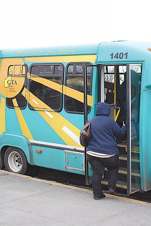 Passengers board a Grant Transit Authority bus in Moses Lake
Monday evening. The GTA recently announced a nearly 9 percent total
ridership increase last year over 2011.