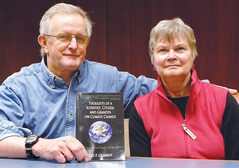 Eric Grimsrud, a professor at Montana State University for 29 years, sits next to his wife, Kathy, while holding his book, &#147;Thoughts of a Scientist, Citizen, and Grandpa on Climate Change.&#148;