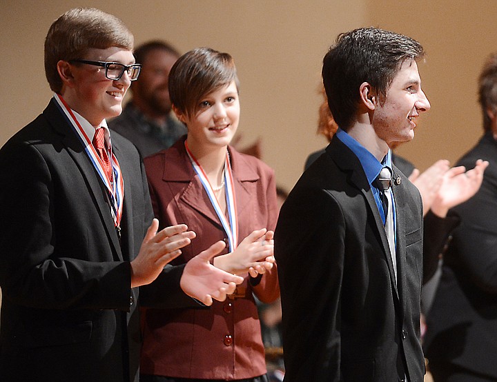 &lt;p&gt;Ethan Hall of Flathead High School stands up to receive his medal for taking first place Saturday in Humorous Oral Interpretation at the State AA Speech and Debate Tournament in Kalispell. In the background are teammates Wyatt Dykhuizen, who placed second, and Sydney Boveng, who was third for an all-Flathead top three.&lt;/p&gt;&lt;p&gt;&lt;/p&gt;