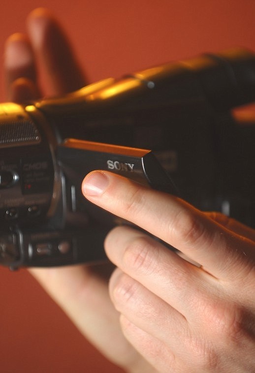 Pitman reviews tape as he works on his documentary about Whitefish Winter Carnival.