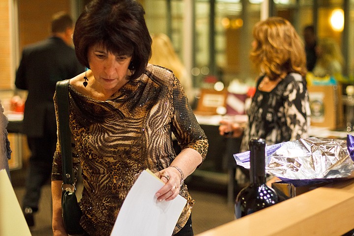 &lt;p&gt;SHAWN GUST/Press Cheri Knobler, of Hayden browses silent auction items at the Kootenai County Task Forces on Human Relations annual gala Monday at Parkside Towers in Coeur d'Alene. The event, held on Martin Luther King, Jr. Day, is the primary fundraising effort of the task force that funds its programs as well as the Human Rights Education Institute.&lt;/p&gt;