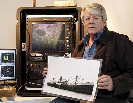 &lt;p&gt;Greg Brooks, co-manager of Sub Sea Research, is seen aboard the salvage ship Sea Hunter in Boston Harbor Wednesday, Feb. 1, 2012 holding a picture of the British merchant ship Port Nicholson which was sunk by a German U-boat in 1942 with a cargo of 71 tons of platinum now worth about $3 billion. Brooks will use the Sea Hunter to recover the cargo of the Port Nicholson. A port hole of the Port Nicholson can be seen on the screen behind Brooks. (AP Photo/Winslow Townson)&lt;/p&gt;