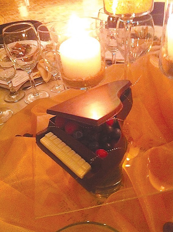 Minature grand piano center pieces made from chocolate and assorted berries graced the tables at Big Bend Community College's Winter Serenade last Saturday.