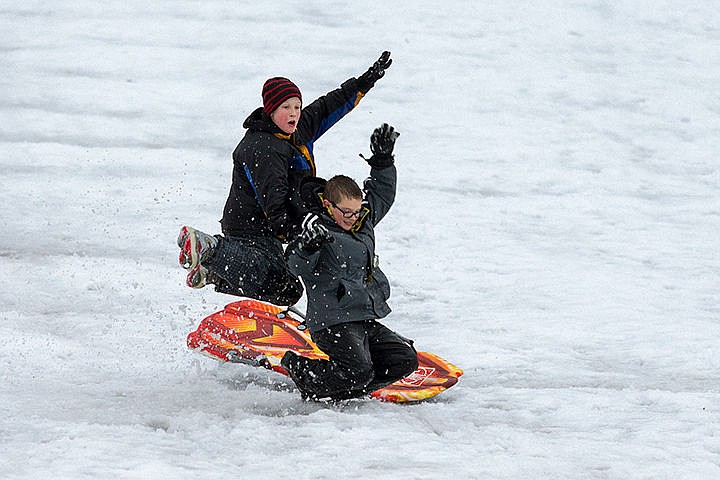 &lt;p&gt;Cody Lippy, 12, left, is launched into the air after hitting a jump while sledding with Mark Priebe, 11, on Cherry Hill Monday in Coeur d&#146;Alene.&lt;/p&gt;