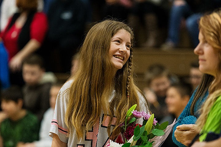 &lt;p&gt;Samantha Lee, a seventh-grade student at Post Falls Middle School, reacts after being announced the winner of the Credit 2 Kids winner by Spokane Teachers Credit Union and KREM 2 for her volunteer work during a presentation Friday in Post Falls. Lee has donated about 40 in the first semester tutoring fellow students after school hours. Post Falls Middle School received $500 on her behalf.&lt;/p&gt;