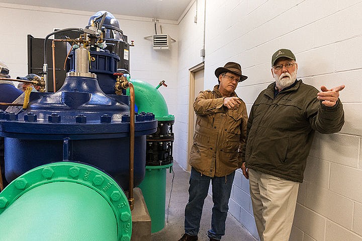 &lt;p&gt;Jim Markley, water superintendent for the City of Coeur d&#146;Alene, right, and councilman Dan Gookin discuss how the workings of the newest water well during a dedication ceremony Friday at the well site on Atlas Road in Coeur d&#146;Alene. The system will increase pumping capacity of the city from 37 million gallons per day to 43 million gallons per day. A a 600-horsepower engine that is capable of pumping 4,000 gallons of water per minute and went online in December.&lt;/p&gt;