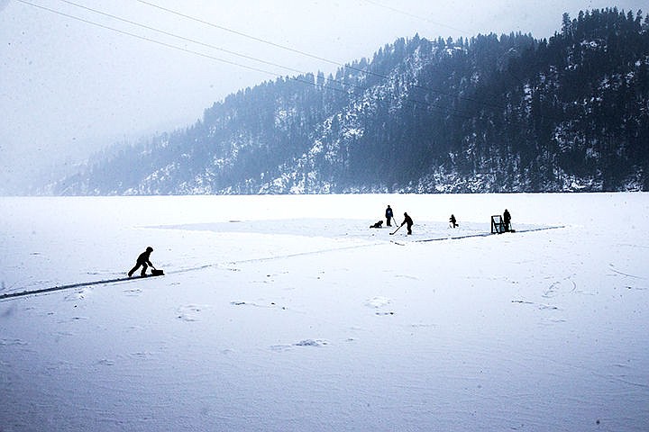 &lt;p&gt;Roan Wheelan shovels fresh snow from a pathway to a homemade hockey rink on Fernan Lake on Saturday afternoon. Temperatures below freezing have solidified a layer of ice that is five inches thick on Fernan Lake.&lt;/p&gt;