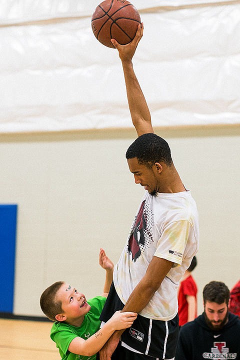 &lt;p&gt;David Baze, a shooting guard for the North Idaho College mens basketball team, keeps the ball out of reach of Kyler Cooley on Monday while the team visited children on the basketball court at the Boys and Girls Club of North Idaho in Post Falls.&lt;/p&gt;