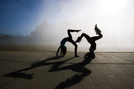 &lt;p&gt;At the edge of the fog, Sommersby Picard, left, and Dakota Ray practice yoga on a quiet Monday morning at McEuen Park in Coeur d'Alene.&lt;/p&gt;