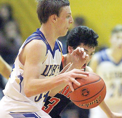 &lt;p&gt;Junior Colin Maloney on the drive fourth quarter vs. Ronan Jan. 30.&lt;/p&gt;