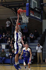 Thompson falls forward Challis Wilson scores an easy lay-up during Friday's loss against Columbia Falls.