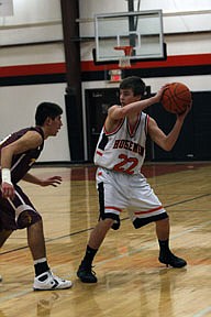 Senior guard Jeff Revier scans the Trojan defense for a weakspot during a 38-57 Horsemen loss versus Troy.