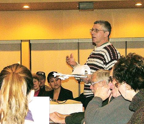 &#151;Photo by MIKE WELAND&lt;br&gt;Moyie Springs Mayor Joe Messenbrink, reading from notes written on what is obviously a historical scroll, injected a welcome note of humor Tuesday night into a meeting of local elected officials who are facing real and harsh challenges &#133; which trusts we will rise to and address.