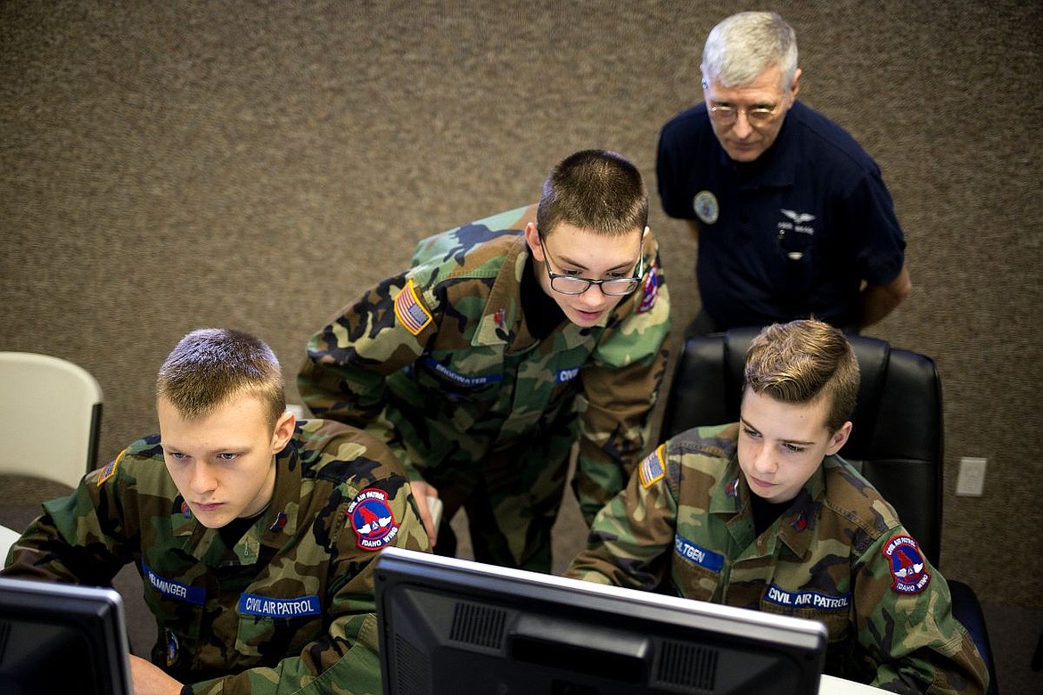 &lt;p&gt;From left to right, Cadet Staff Sgt. Nathan Helminger, Cadet Airman First Class Bailey Brodwater, Coach Paul Brand and Cadet Staff Sgt. William Roltgen of the Coeur d&#146;Alene Composite Squadron of the Civil Air Patrol work through simulated cybersecurity scenarios on Saturday at the Lifeway Chapel in Post Falls. The team is competing for a spot at the National Cyber Defense Competition, a contest put on by the Air Force Association's National Youth Cyber Education Program.&lt;/p&gt;