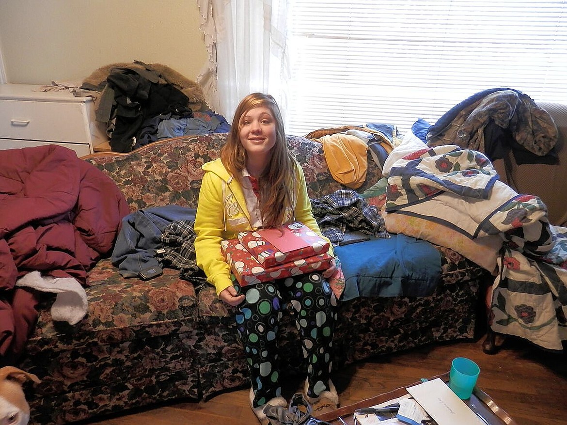 &lt;p&gt;Brianna Cook poses for a photo on Christmas morning in Pinehurst. Cook, 17, was found dead in her father's Pinehurst home on Oct. 26, 2013.&lt;/p&gt;