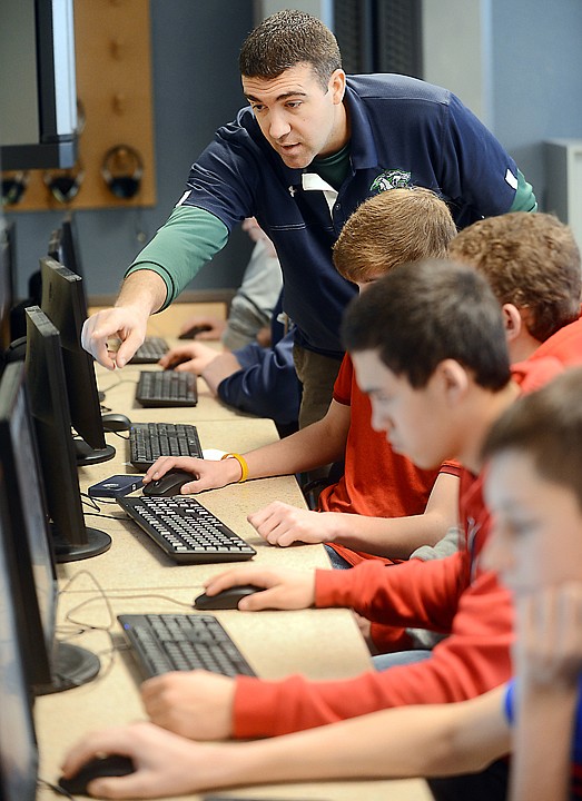 <p>Andy Fors helps students in his Introduction to Engineering Design class on Friday, January 31, at Glacier High School in Kalispell. (Brenda Ahearn/Daily Inter Lake)</p>