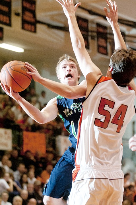 &lt;p&gt;Glacier's Evan Epperly (left) puts up a shot as Flathead's Garth
West (54) defends during the crosstown basketball game at Flathead
High School Thursday night.&lt;/p&gt;