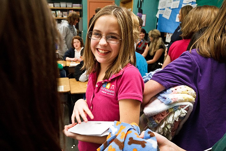 &lt;p&gt;Shealyn McCune, a fifth-grader at Sorenson Magnet School, visits with class mates Wednesday following a presentation by the school's new group Young People in Charge to the Kootenai County Humane Society.&lt;/p&gt;